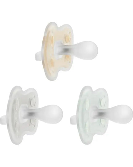 Three white pacifiers on a white background