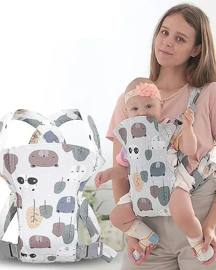 Woman holding a baby in a baby carrier with a white background