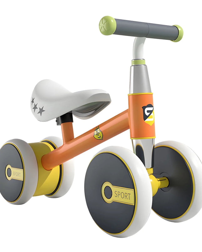 Children's balance bike with orange frame, gray handlebar, and black and yellow wheels on a white background