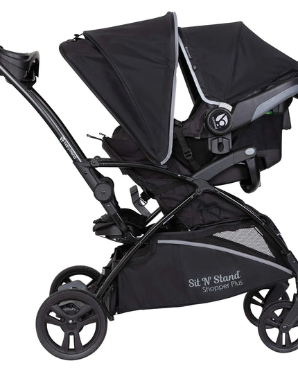 Black stroller with canopy on a white background