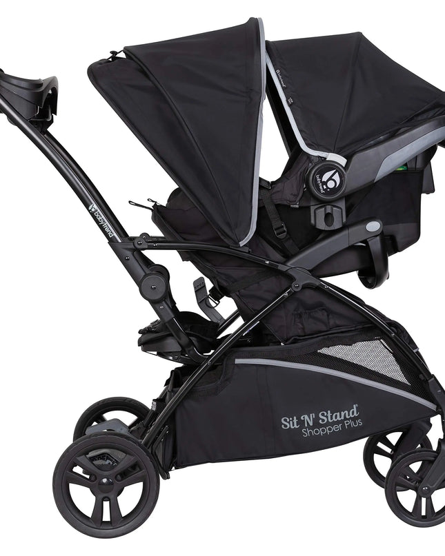 Black stroller with canopy on a white background