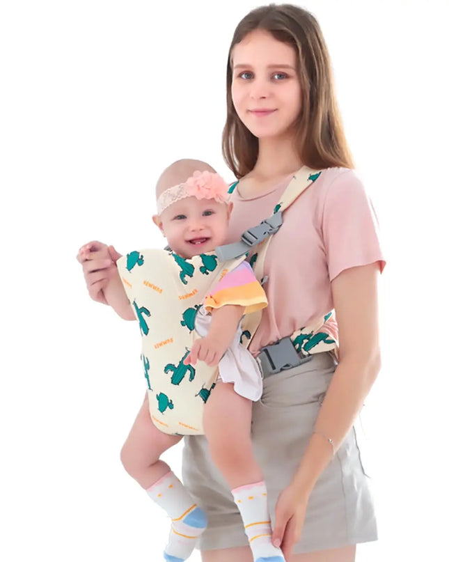 Woman holding a baby in a carrier against a white background