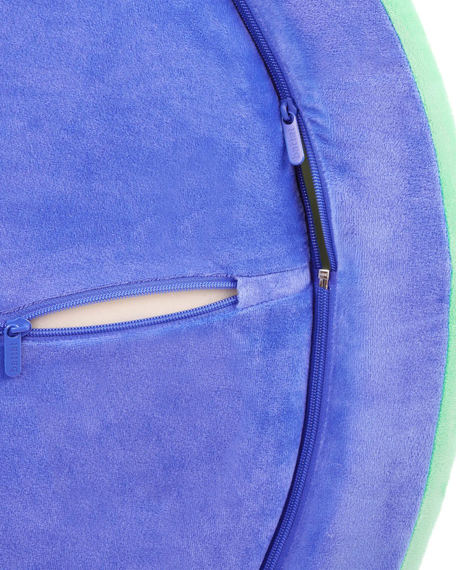 Close-up of a blue fabric with a zipper pocket on a white background