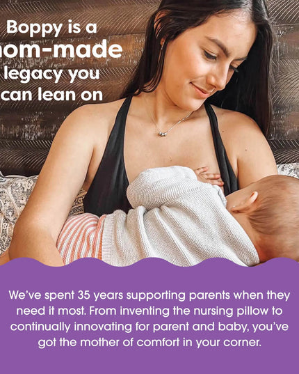 Woman holding a baby with promotional text about Boppy products.
