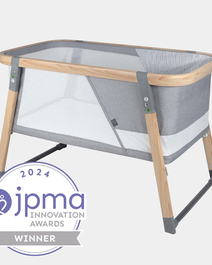 Portable crib with JPMA Innovation Awards 2024 badge on a white background