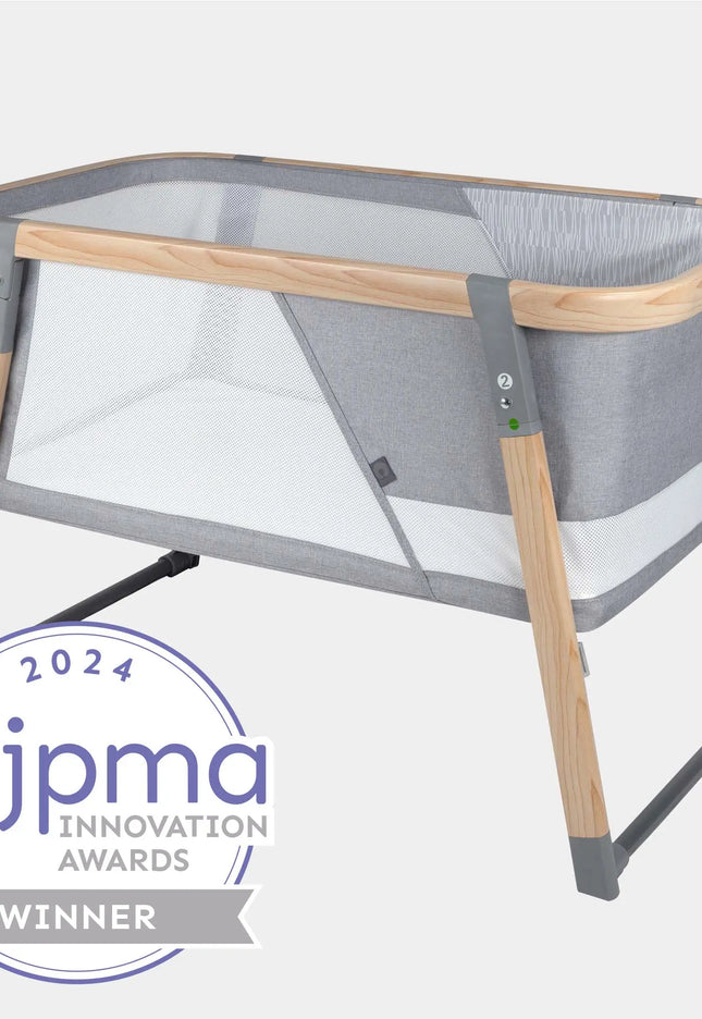 Portable crib with JPMA Innovation Awards 2024 badge on a white background