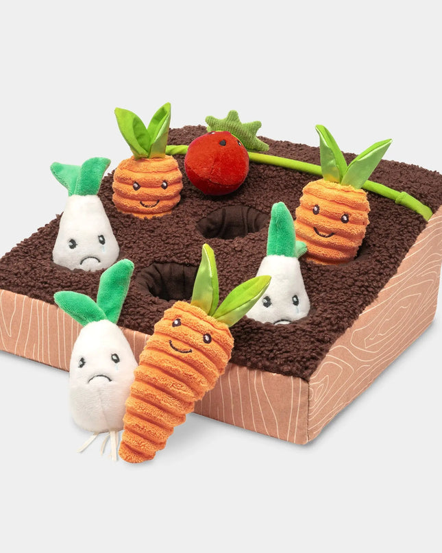 Plush toy set of vegetables in a garden bed on a light gray background