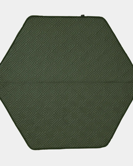 Hexagonal green mat with a geometric pattern on a white background