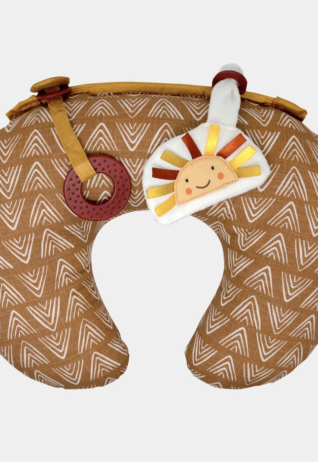 Neck pillow with a patterned design and a toy attached on a white background