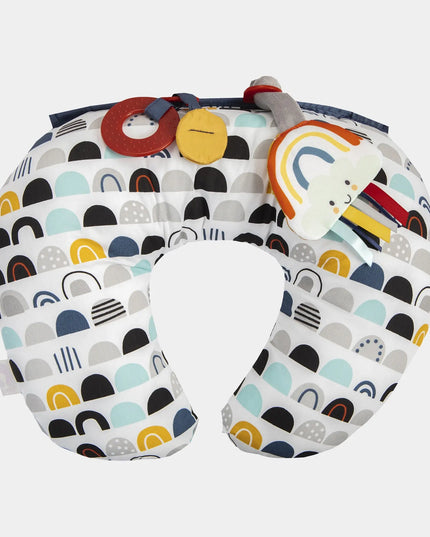Colorful baby boppy pillow with abstract patterns on a white background