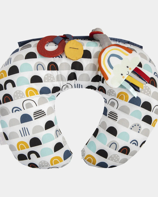 Colorful baby boppy pillow with abstract patterns on a white background