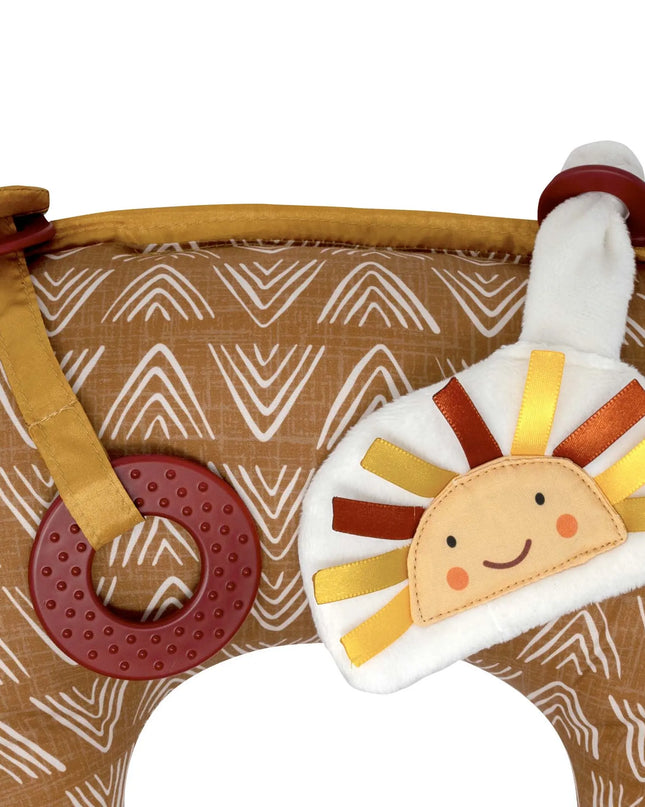 Children's teething toy with lion design on a brown fabric background