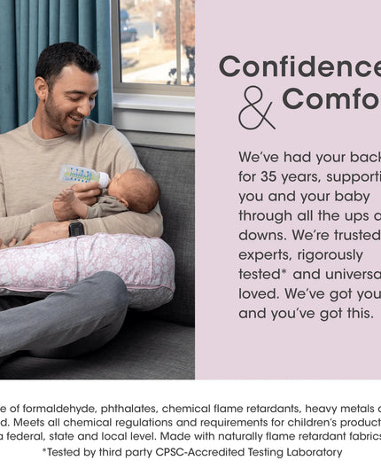 Man holding a baby and bottle with text about confidence and comfort, featuring a product with flame retardant properties.