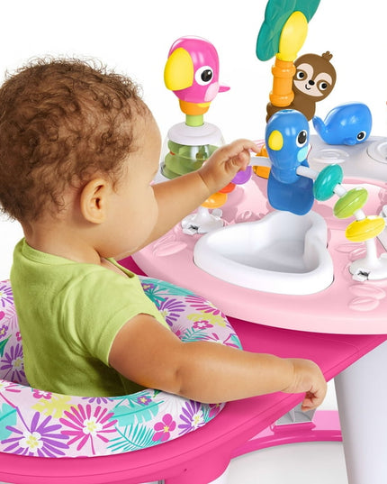 Child playing with a colorful baby activity center