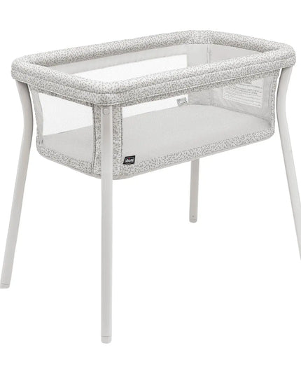 White crib with gray textured sides on a white background