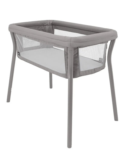 Gray baby crib with mesh sides on a white background