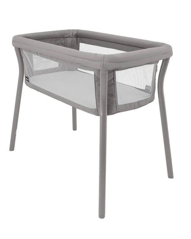 Gray baby crib with mesh sides on a white background