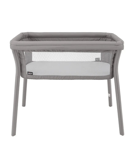 Gray baby bassinet with mesh sides on a white background