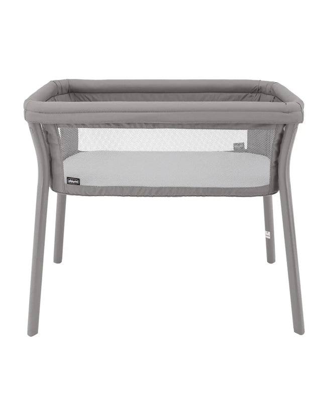 Gray baby bassinet with mesh sides on a white background