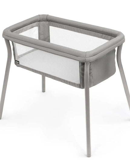 Portable crib with mesh sides on a white background