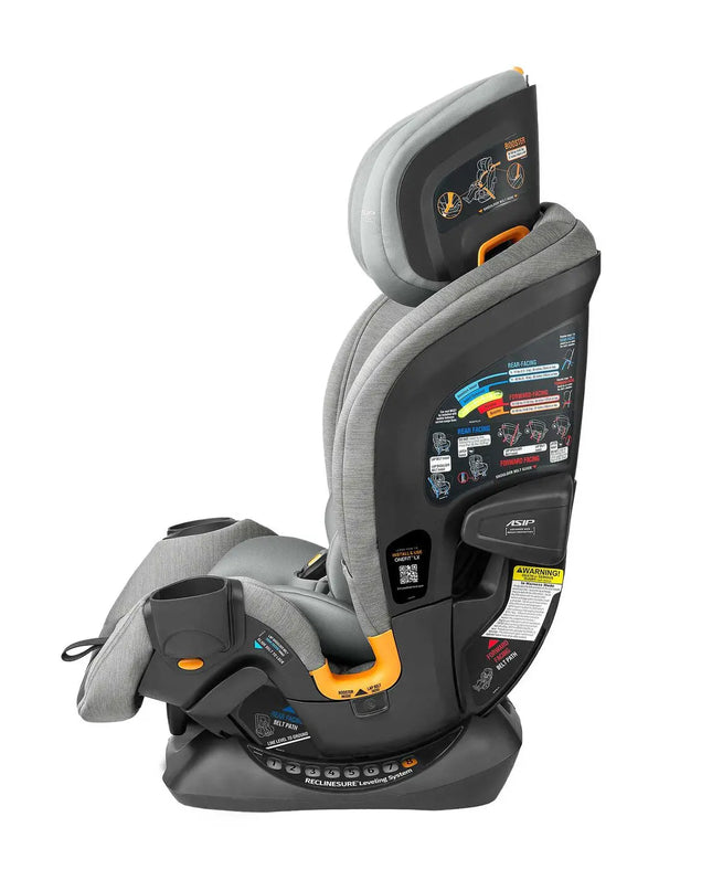 Gray and black car seat with multiple labels on a white background