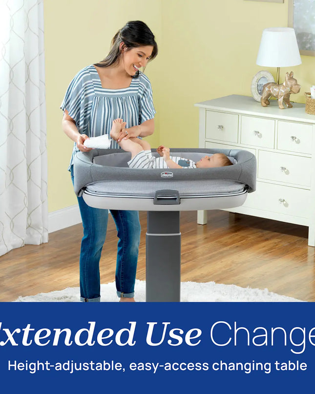 Woman with a baby in an extended use changing table in a home setting