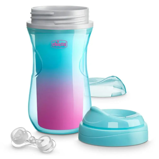 Gradient blue and pink sippy cup with additional components on a white background