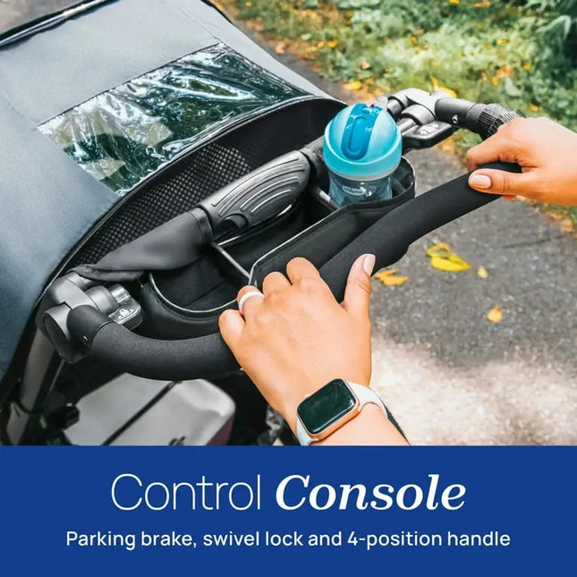 Control console with parking brake, swivel lock, and 4-position handle on a vehicle, with a person's hand interacting with it.