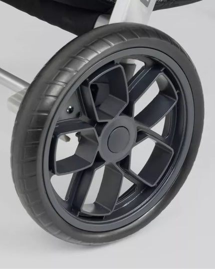 Close-up of a black wheel with a white background
