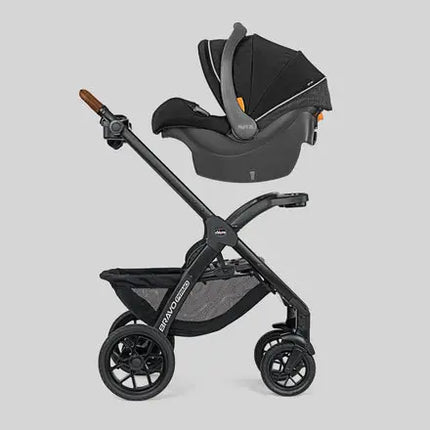 Black stroller and car seat combo on a light gray background