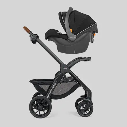 Black stroller and car seat combo on a light gray background