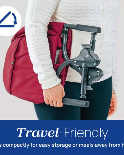 Person holding a travel-friendly device with a red backpack, emphasizing portability.