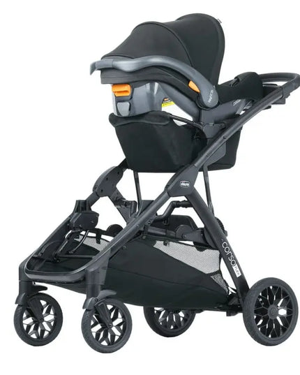 Black stroller with car seat attachment on a white background