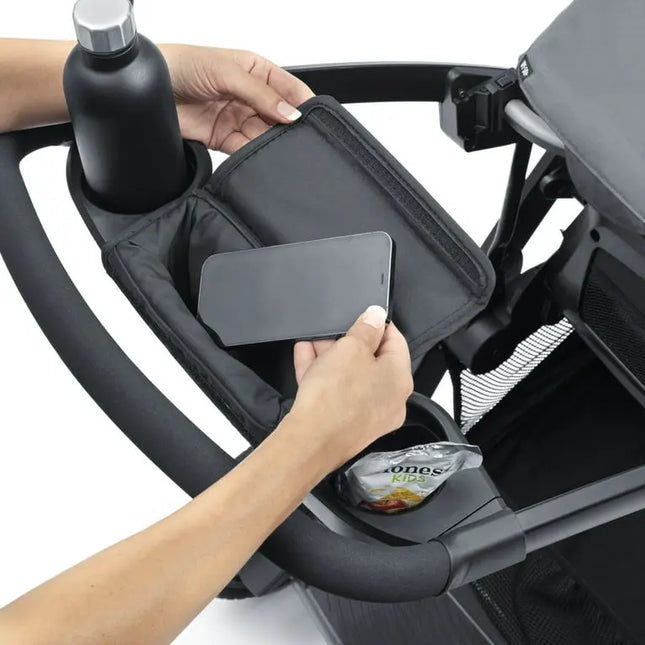 Hand using a phone holder attached to a stroller.