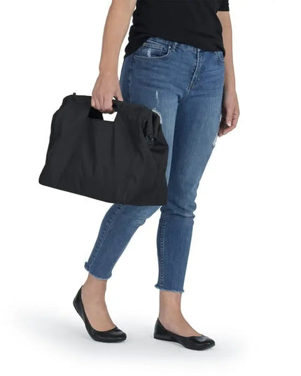 Person holding a black bag with a white background