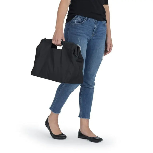 Person holding a black bag with a white background