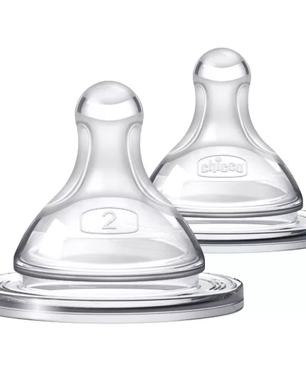 Two clear baby bottle nipples on a white background