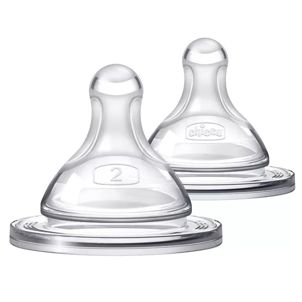 Two clear baby bottle nipples on a white background
