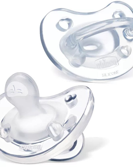 Two clear baby pacifiers on a white background