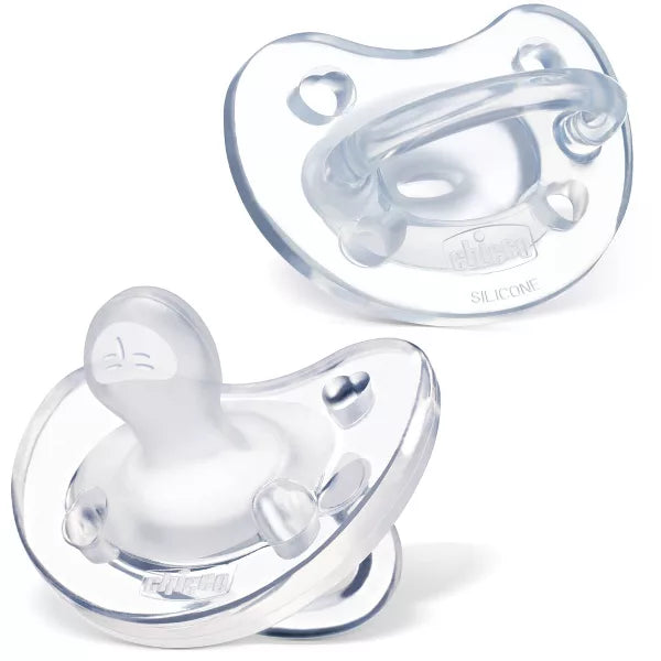 Two clear baby pacifiers on a white background