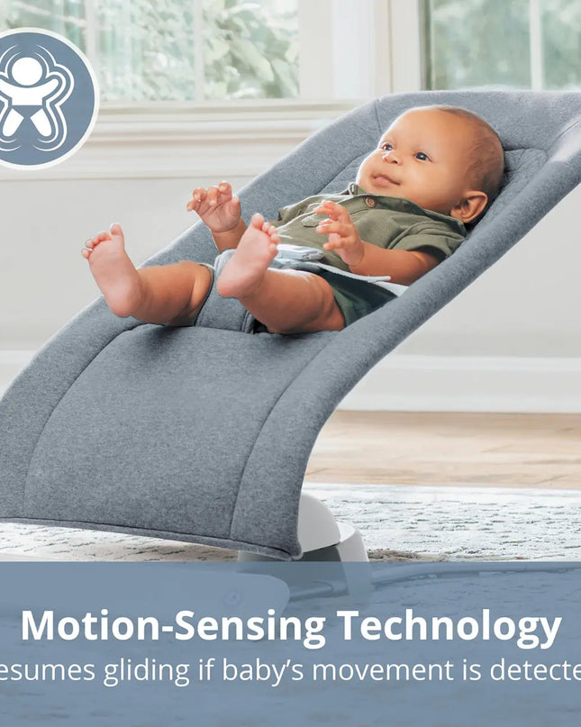 Baby in a gray baby bouncer with motion-sensing technology text