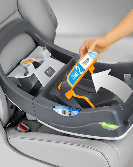 Child safety car seat with a hand holding a stage 2 label