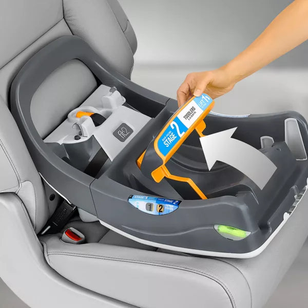 Child safety car seat with a hand holding a stage 2 label