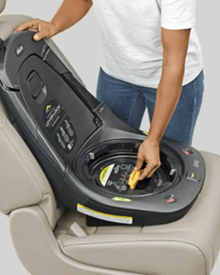 Person adjusting a car seat in a vehicle