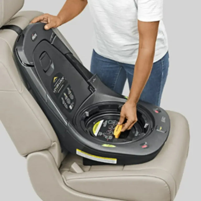 Person adjusting a car seat in a vehicle