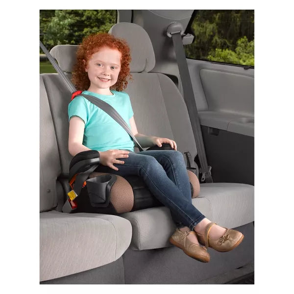 Child sitting in a car seat with a safety harness in a vehicle.