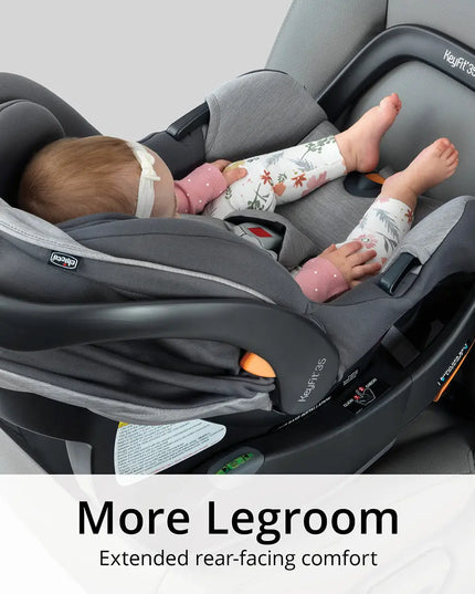 Baby in a car seat with extended legroom, brand 'Maxi-Cosi' visible