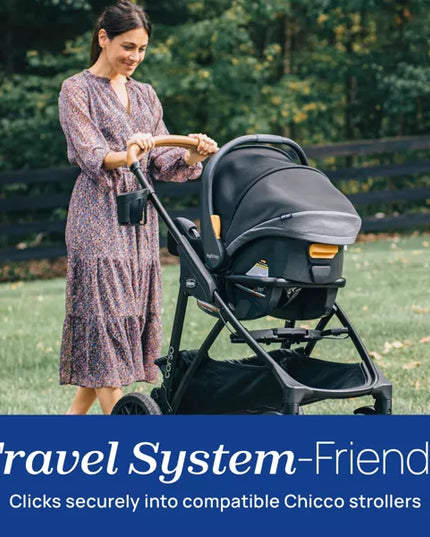 Woman pushing a Chicco stroller in a park with text about travel system-friendliness.