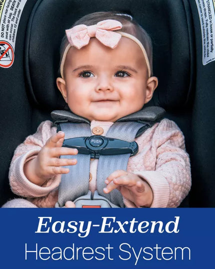 Baby in a car seat with an 'Easy-Extend Headrest System' label