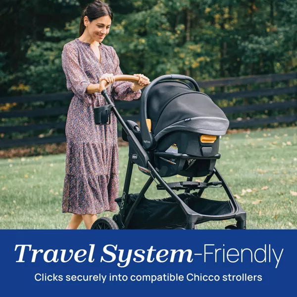 Woman pushing a Chicco stroller in a park with text about travel system-friendliness.